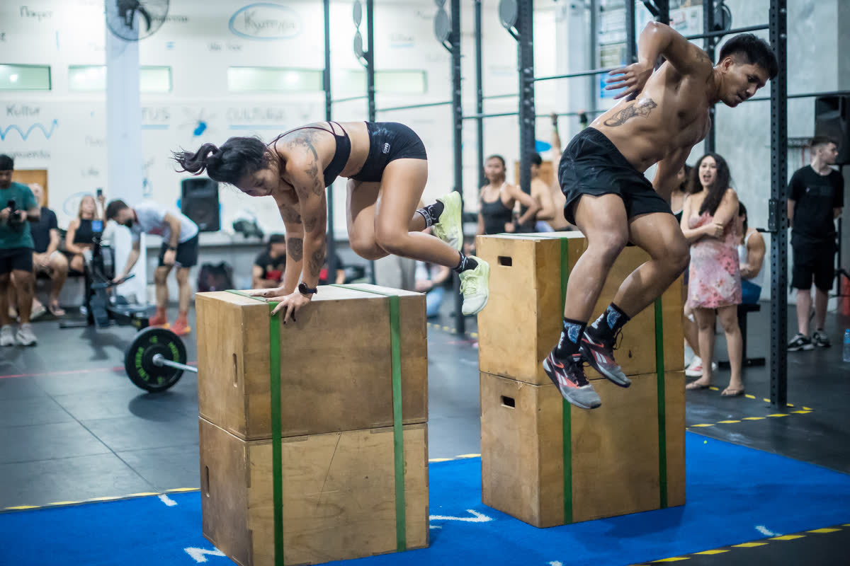 Athletes jumping onto boxes